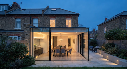 Modern glass extension on a traditional Victorian brick home